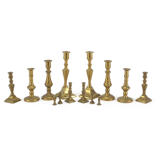 183A - Brass candlesticks including miniatures, the largest 14.5cm high