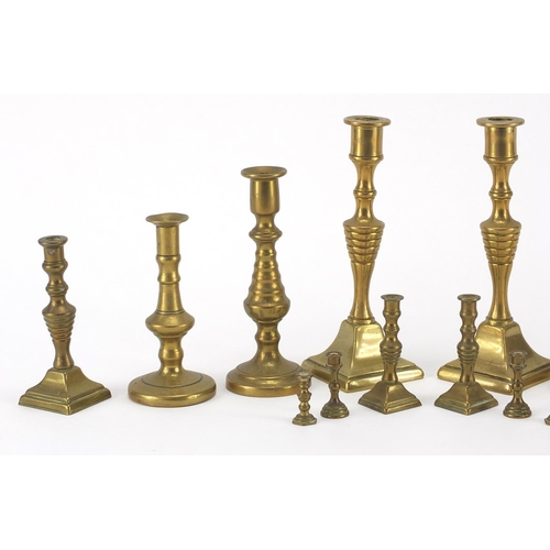 183A - Brass candlesticks including miniatures, the largest 14.5cm high