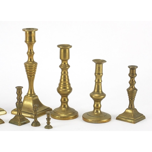 183A - Brass candlesticks including miniatures, the largest 14.5cm high