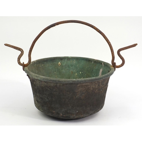 124 - Antique copper cauldron with swing handle, 51cm in diameter