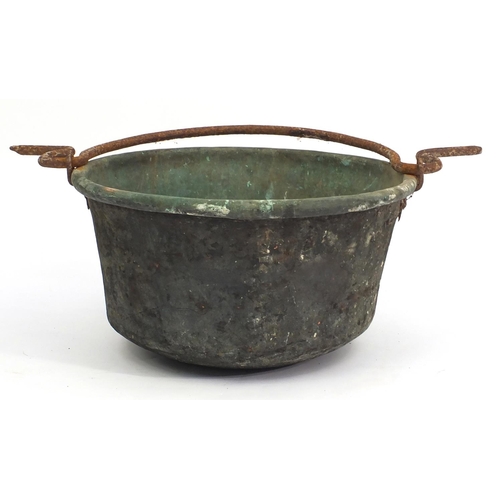 124 - Antique copper cauldron with swing handle, 51cm in diameter