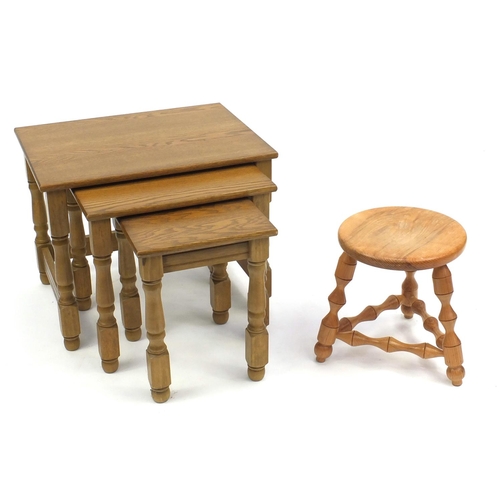 99 - Nest of three light oak occasional tables and a light wood tripod stool