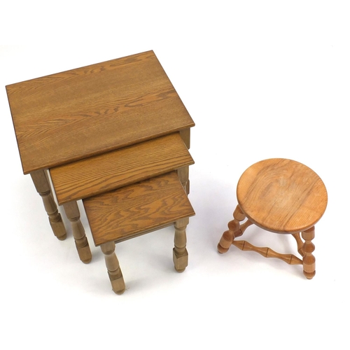 99 - Nest of three light oak occasional tables and a light wood tripod stool