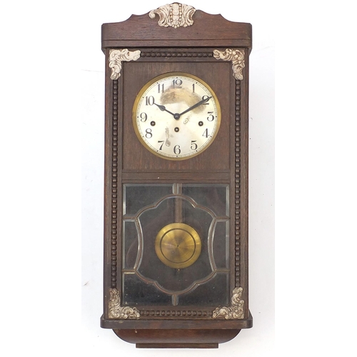 135 - Oak wall hanging clock with Westminster chime, 78cm in length