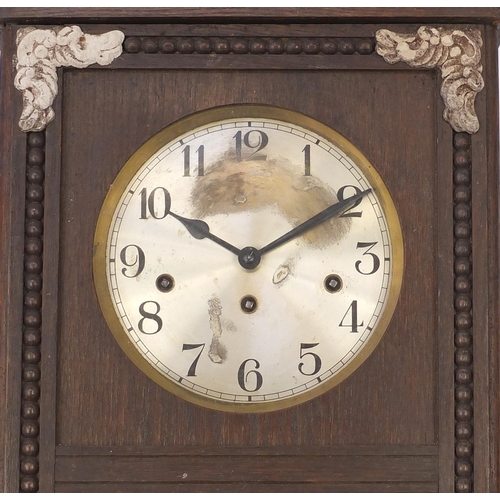 135 - Oak wall hanging clock with Westminster chime, 78cm in length