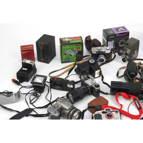 194 - Vintage and later cameras, lenses and accessories including Yashica, Olympus and Kodak examples