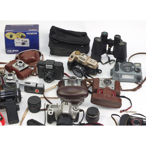 194 - Vintage and later cameras, lenses and accessories including Yashica, Olympus and Kodak examples