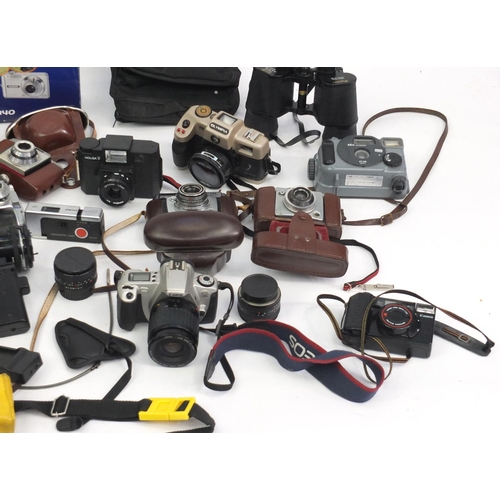 194 - Vintage and later cameras, lenses and accessories including Yashica, Olympus and Kodak examples