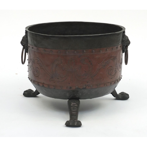 183 - Copper coal bucket with paw feet and lion mask handles, 29cm high x 34cm in diameter