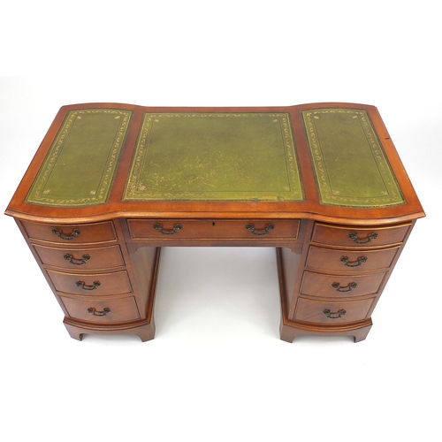 2021 - *Dscription amended 14-04-18*Mahogany twin pedestal desk with green leather inserts, fitted with nin... 
