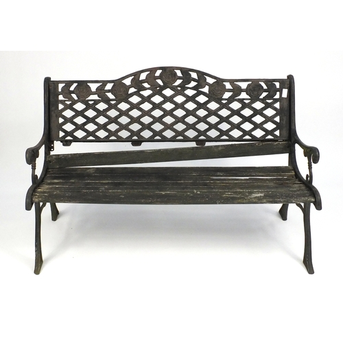 125 - Wrought iron garden table, bench and two chairs