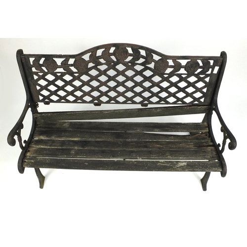 125 - Wrought iron garden table, bench and two chairs