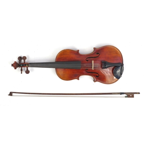 234 - Old wooden violin with scrolled neck, bow and fitted carrying case, the violin back 13.5