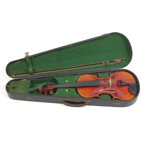 234 - Old wooden violin with scrolled neck, bow and fitted carrying case, the violin back 13.5