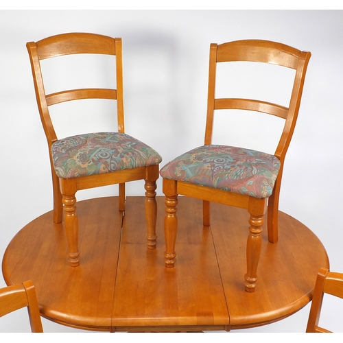 91 - Malaysian circular light wood extending dining table and four chairs