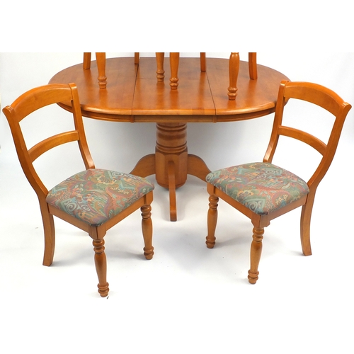 91 - Malaysian circular light wood extending dining table and four chairs