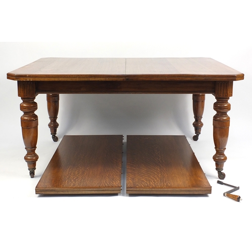 8 - Victorian oak wind out dining table with two extra leaves and winder, 74cm H x 150cm W x 122cm D