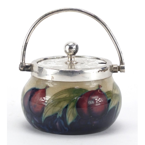944 - Moorcroft Wysteria pattern pottery preserve jar with silver plated mounts and swing handle, 7.5cm hi... 