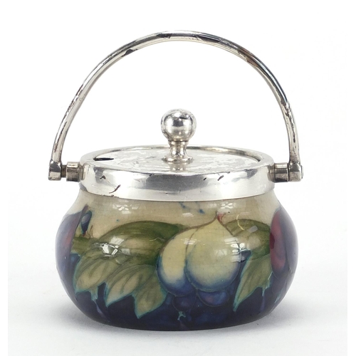 944 - Moorcroft Wysteria pattern pottery preserve jar with silver plated mounts and swing handle, 7.5cm hi... 
