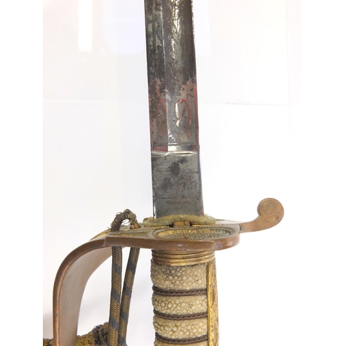 574 - George V Naval dress sword, retailed by Gieves with scabbard and wire bound shagreen grip, steel bla... 