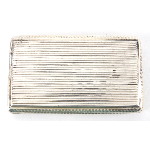 40 - Rectangular continental silver snuff box with engine turned decoration, the hinged lid engraved with... 