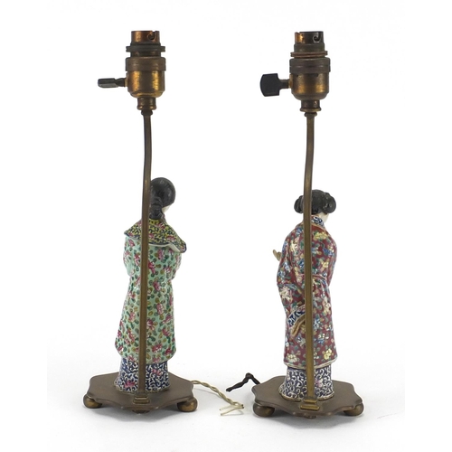 638 - Pair of Chinese porcelain figural lamp bases with bronze mounts, each hand painted in the famille ro... 