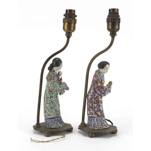 638 - Pair of Chinese porcelain figural lamp bases with bronze mounts, each hand painted in the famille ro... 