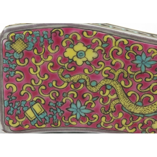 623 - Chinese porcelain wrist rest, hand painted in the famille rose palette with a dragon amongst flowers... 