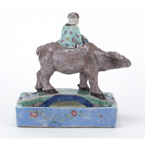 611 - Chinese porcelain boy and a buffalo crossing a bridge brush washer, finely hand painted in the famil... 