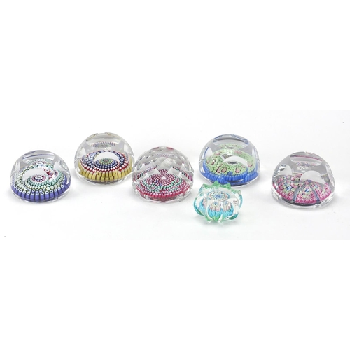 912 - Six colourful glass paperweights including a Whitefriars Christmas 1979 Millefiori paperweight, the ... 