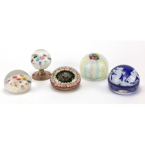 913 - Five colourful glass paperweights, including one with a classical scene, Italian example with two fi... 