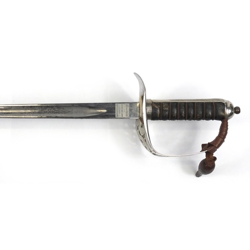 577 - British Military Calvary sword by Sanderson Bros & Newbould of Sheffield, with leather scabbard and ... 