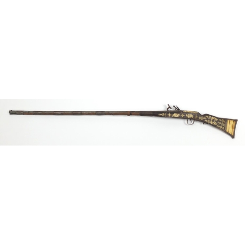 583 - Indian flint lock rifle with bone inlay and a similar pistol, the largest 160cm in length