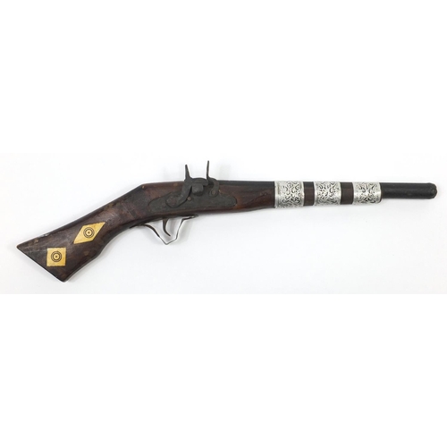 583 - Indian flint lock rifle with bone inlay and a similar pistol, the largest 160cm in length