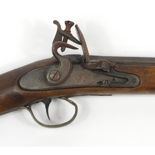 581 - 19th century flint lock rifle, the barrel with impressed proof marks, 126cm in length