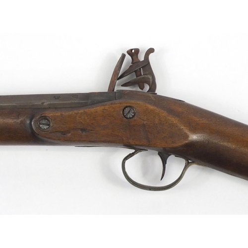 581 - 19th century flint lock rifle, the barrel with impressed proof marks, 126cm in length