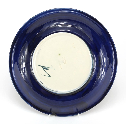 949 - Moorcroft Poppy pattern pottery plate, impressed factory marks to the base, 22cm in diameter