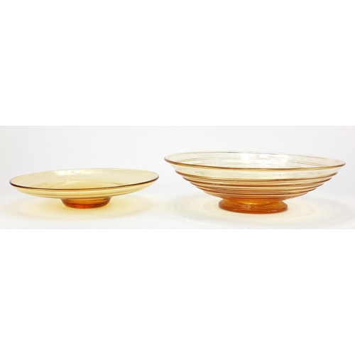 938 - Two Whitefriars tangerine glass dishes including a footed ribbon example designed by Tom Hill, the l... 