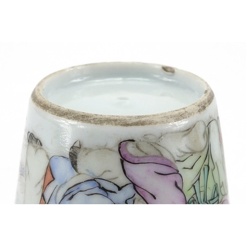 633 - Pair of Chinese porcelain fluted tea cups, each hand painted in the famille rose palette with two fi... 