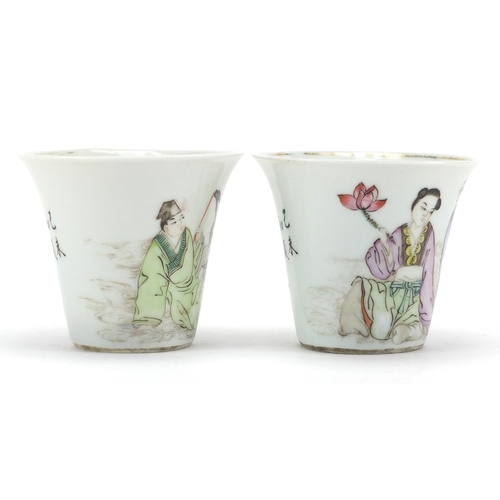 633 - Pair of Chinese porcelain fluted tea cups, each hand painted in the famille rose palette with two fi... 