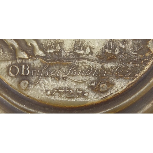 26 - John Obrisset oval pressed horn snuff box, the lid depicting George II before battleships, impressed... 