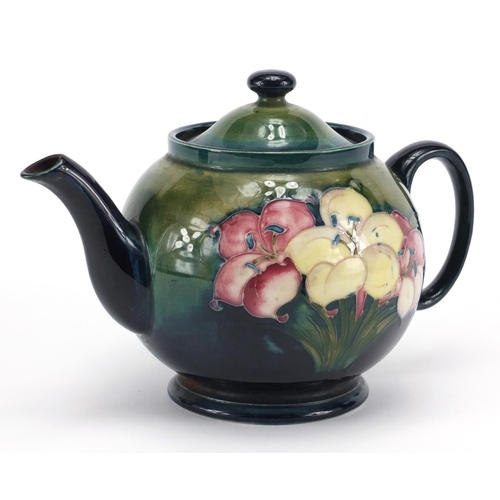 945 - Moorcroft Freesia pattern pottery teapot, hand painted and impressed factory marks to the base, 15.5... 