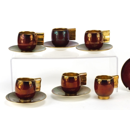 961 - Carlton Ware coffee cans and saucers with gilt handles comprising ten cups and six saucers, each cup... 