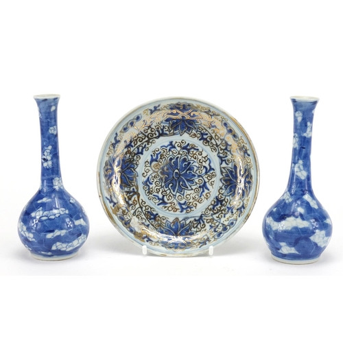 600 - Pair of Chinese blue and white porcelain Prunus bottle vases, together with a blue and white gilded ... 