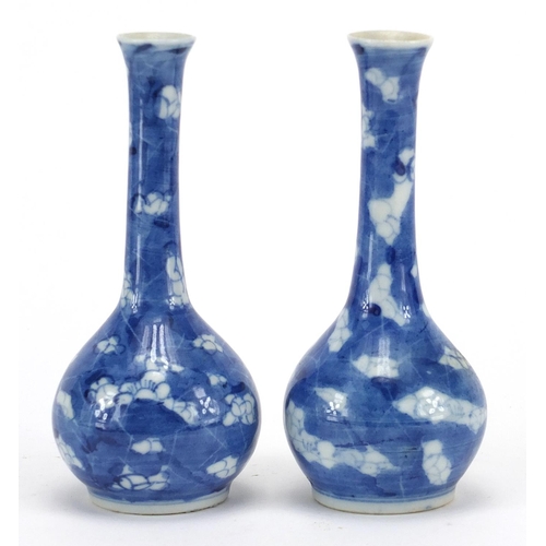 600 - Pair of Chinese blue and white porcelain Prunus bottle vases, together with a blue and white gilded ... 