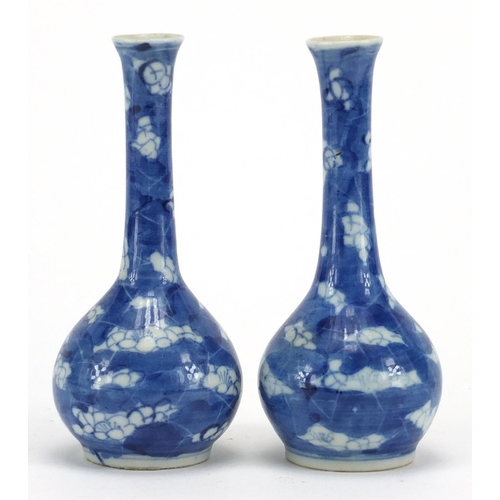 600 - Pair of Chinese blue and white porcelain Prunus bottle vases, together with a blue and white gilded ... 