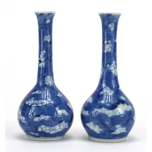 600 - Pair of Chinese blue and white porcelain Prunus bottle vases, together with a blue and white gilded ... 