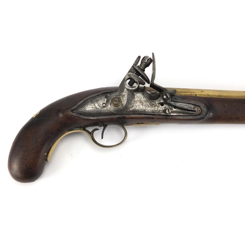 585 - 19th century flint lock pistol by Davidson, the brass barrel with engraved decoration and engraved S... 