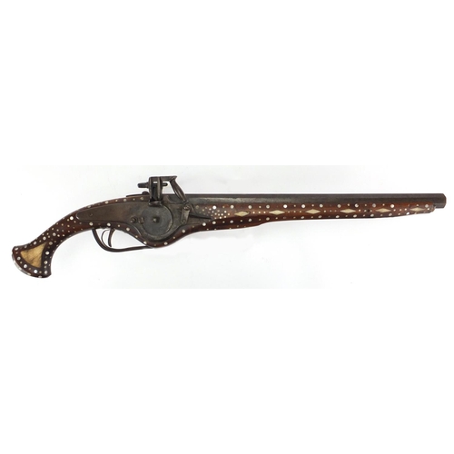 582 - Antique wheel-lock pistol with octagonal barrel, inlaid with bone and Mother of Pearl, 65cm in lengt... 