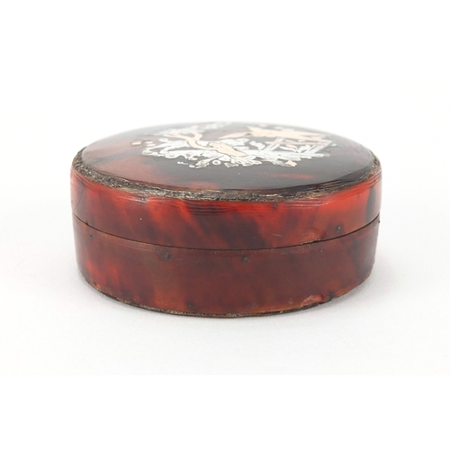 25 - 18th century circular red tortoiseshell snuff box with gold and silver pique work, decorated with a ... 